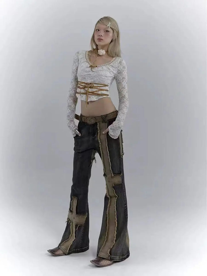 Model wearing the blue Distressed Patchwork Cross Jeans
