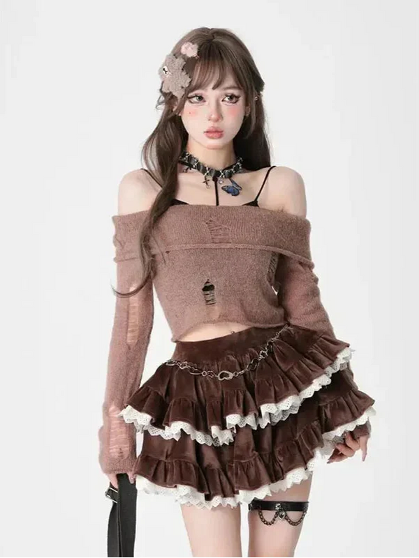 Woman wearing a brown outfit with ruffled skirt and floral headpiece on a white background